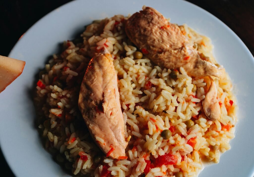 Close-up of a savory chicken and rice dish, perfect for dinner or lunch.